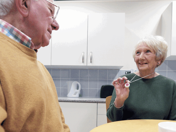 Older man and woman sitting at a table 