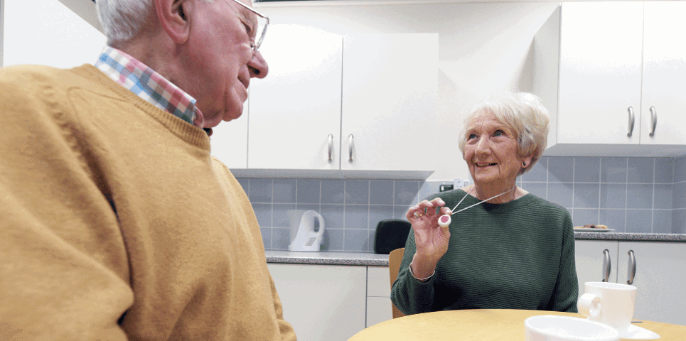 Older man and woman sitting at a table 