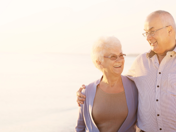 a couple enjoying their time down the beach