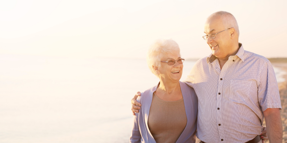 a couple enjoying their time down the beach