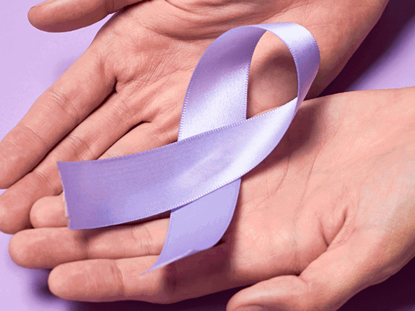 Photo of purple ribbon in hand