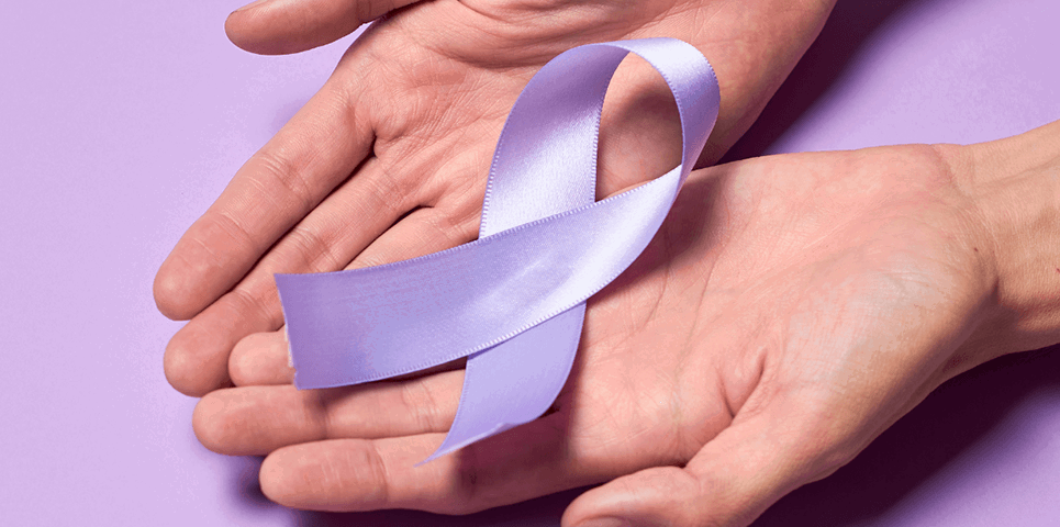 Photo of purple ribbon in hand