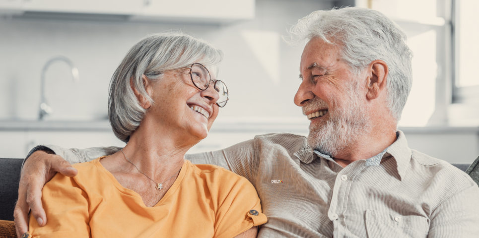 Older couple smiling and embracing one another