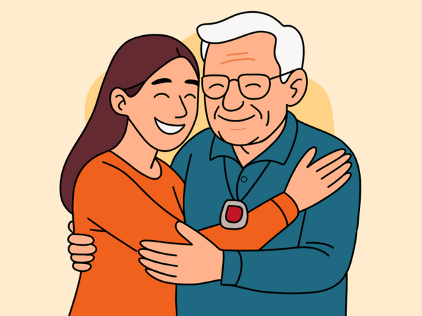 Smiling woman hugs an elderly man wearing a red-button pendant alarm, symbolising care and support through technology-enabled care.