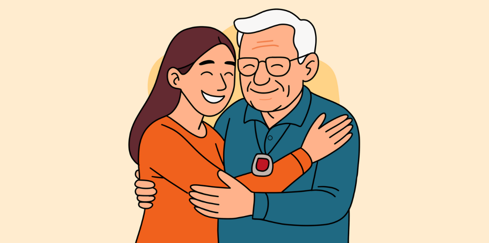 Smiling woman hugs an elderly man wearing a red-button pendant alarm, symbolising care and support through technology-enabled care.