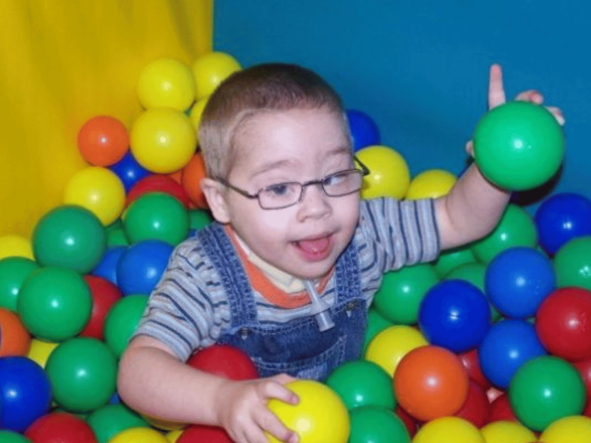 Aled pictured playing in a ball pit