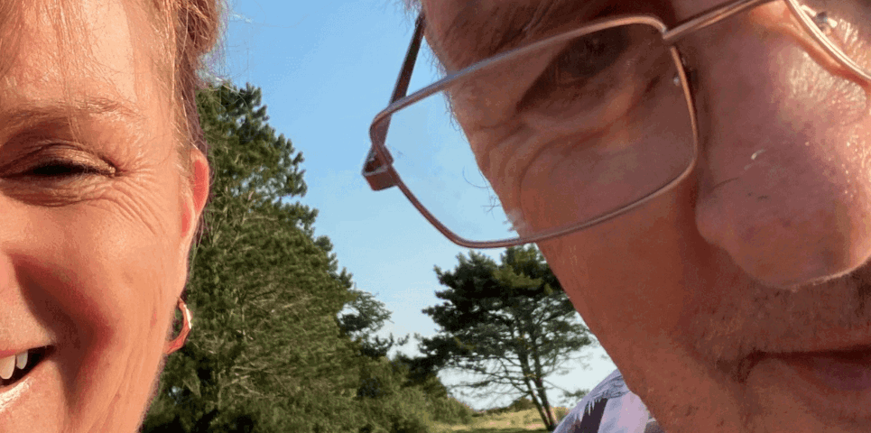 Husband and wife together smiling