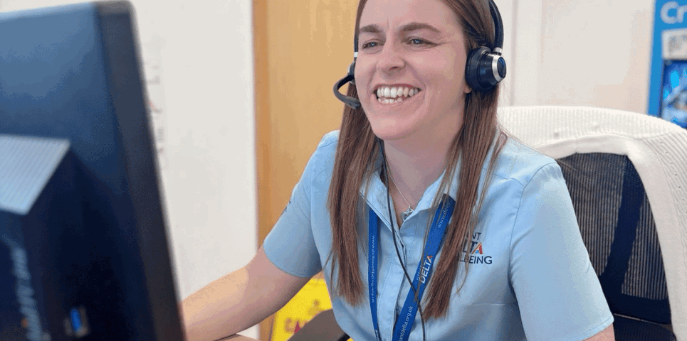 Delta Wellbeing adviser at her desk answering emergency calls