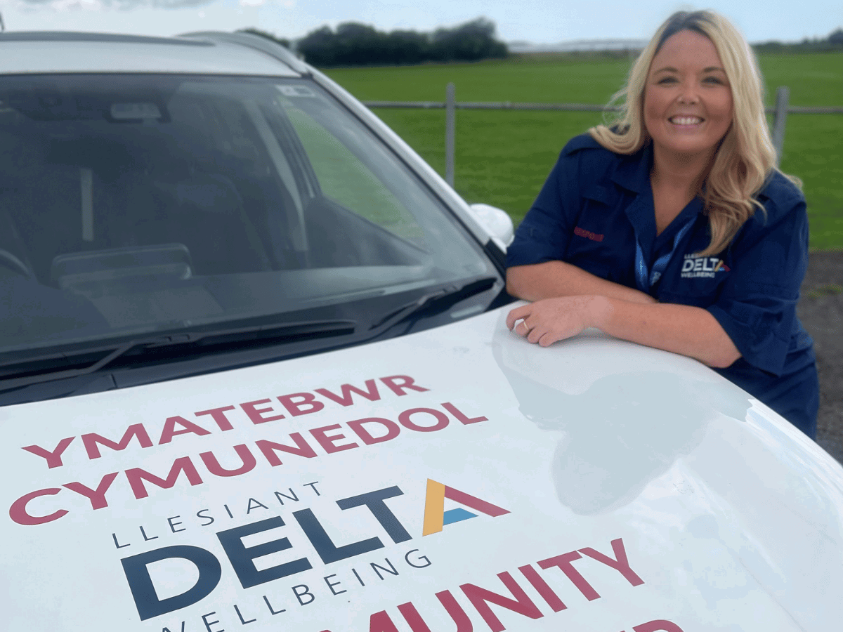 Delta staff member with Delta Car