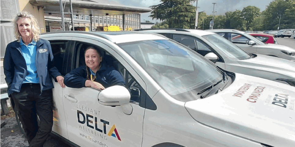 HomeSafe staff Naomi and Beverly with car outside hospital.